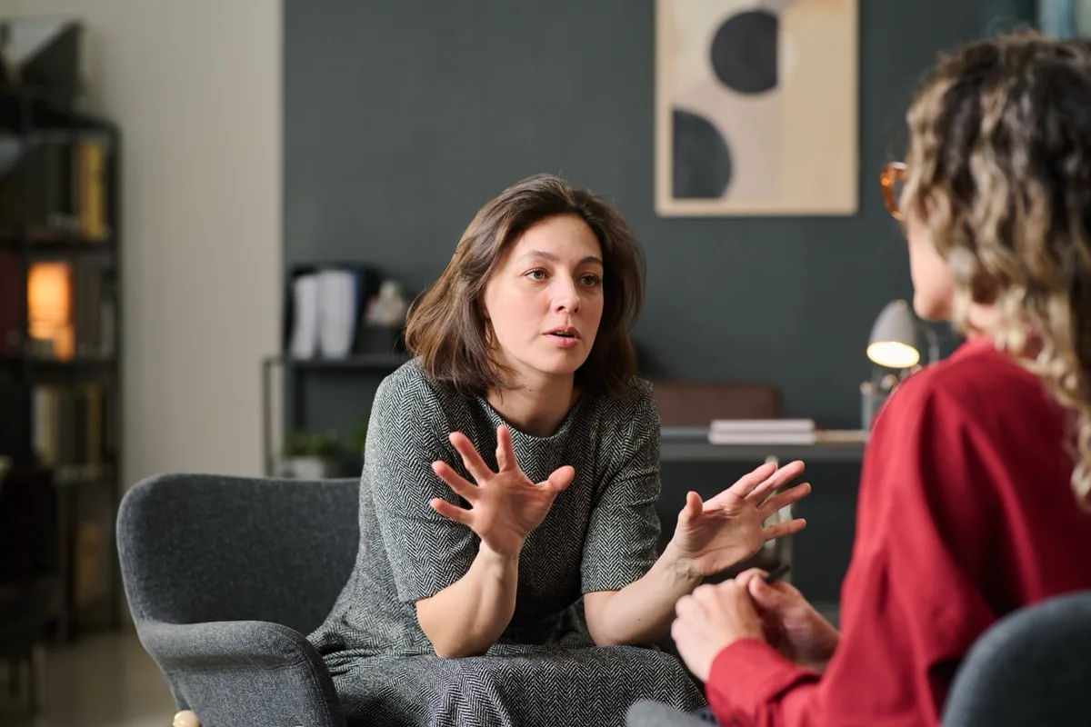 A woman speaking with a therapist.