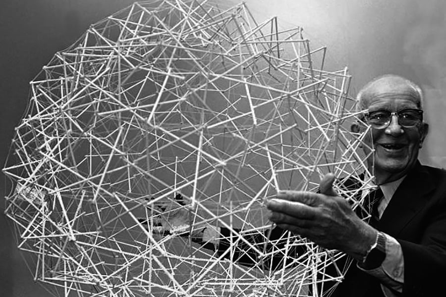 Buckminster Fuller holding a geometric model.